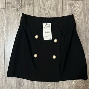 BNWT Zara black mini skirt pearl button detail wrap style in front size medium